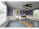 An inviting bedroom with purple walls, white trim and a ceiling fan at 7129 Dexter Rd, Oxford, NC 27565
