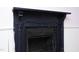 A close up interior shot of a fireplace with black painted trim and brick surround at 7129 Dexter Rd, Oxford, NC 27565