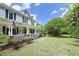 Charming two-story farmhouse with a welcoming porch and beautifully landscaped front yard at 7129 Dexter Rd, Oxford, NC 27565