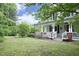 Charming two-story farmhouse with a welcoming porch and beautifully landscaped front yard at 7129 Dexter Rd, Oxford, NC 27565