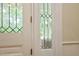Decorative glass panes that bring elegance, while allowing natural light to fill the foyer space at 7129 Dexter Rd, Oxford, NC 27565