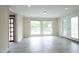 Bright living room with neutral walls, ceramic tile floor and large windows at 7129 Dexter Rd, Oxford, NC 27565