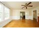 Open living area with hardwood floors, wainscoting, bright windows, and traditional details at 7129 Dexter Rd, Oxford, NC 27565