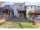 Townhome backyard with fenced perimeter and multiple decks, providing an outdoor area for relaxation and entertaining at 7324 Summerland Dr, Raleigh, NC 27612