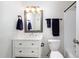 A charming bathroom with a mirror, vanity, toilet, and shower with a shower curtain at 7324 Summerland Dr, Raleigh, NC 27612