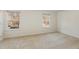 A well-lit bedroom that has two windows with carpet flooring at 7324 Summerland Dr, Raleigh, NC 27612