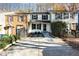 View of the home's exterior and a concrete driveway leading to the townhome at 7324 Summerland Dr, Raleigh, NC 27612