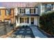 Charming two-story home with black shutters, manicured shrubs, and walkway to front door at 7324 Summerland Dr, Raleigh, NC 27612