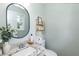 Tastefully decorated bathroom featuring granite countertops, a stylish mirror, and modern fixtures at 7698 Nc Highway 222, Kenly, NC 27542