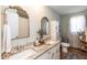 Elegant bathroom featuring dual sinks, granite countertops, and ornate mirrors for a touch of luxury at 7698 Nc Highway 222, Kenly, NC 27542