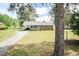 Charming brick home with a well-manicured lawn and a welcoming front porch at 7698 Nc Highway 222, Kenly, NC 27542