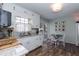 Bright kitchen with white cabinets, granite countertops, and a cozy breakfast nook at 7698 Nc Highway 222, Kenly, NC 27542
