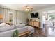 Cozy living room with a large sectional sofa and stylish wooden furniture at 7698 Nc Highway 222, Kenly, NC 27542