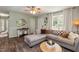 Comfortable living room featuring a plush sectional sofa and soft natural light at 7698 Nc Highway 222, Kenly, NC 27542
