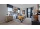 Spacious bedroom with patterned wallpaper, bedside tables, and a comfortable bed at 770 Dorset Stream Dr, Fuquay Varina, NC 27526