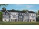 Charming townhome featuring a modern exterior, manicured lawn, and inviting curb appeal at 770 Dorset Stream Dr, Fuquay Varina, NC 27526