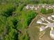 A stunning overhead view of a property in a serene neighborhood with lush greenery at 80 Doonbeg Dr, Fuquay Varina, NC 27526