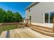 Expansive wooden back deck with stairs, offering a relaxing outdoor space for entertaining at 80 Doonbeg Dr, Fuquay Varina, NC 27526