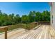 This backyard features a deck overlooking lush greenery at 80 Doonbeg Dr, Fuquay Varina, NC 27526