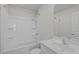 Clean bathroom featuring a shower-tub combo, toilet, sleek vanity and full mirror at 80 Doonbeg Dr, Fuquay Varina, NC 27526