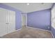 The bedroom has a closet, carpeting, calming colors, and bright windows for natural light at 80 Doonbeg Dr, Fuquay Varina, NC 27526