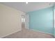 Bedroom featuring neutral carpet and calming walls with access to another room at 80 Doonbeg Dr, Fuquay Varina, NC 27526