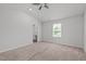 Spacious carpeted bedroom boasts vaulted ceilings and an en-suite bathroom for added privacy at 80 Doonbeg Dr, Fuquay Varina, NC 27526