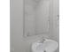 A half-bath features a single sink, large mirror, and white fixtures at 80 Doonbeg Dr, Fuquay Varina, NC 27526