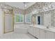 Spacious bathroom with large tub, shower, double vanity, and shuttered windows for natural light at 8012 Glenbrittle Way, Raleigh, NC 27615