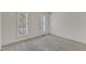 Bright bedroom with neutral carpet and shuttered windows offering plenty of natural light at 8012 Glenbrittle Way, Raleigh, NC 27615