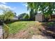 Picturesque backyard view with a storage shed, a grill, and lush green grass at 806 Edmund St, Raleigh, NC 27604