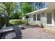 Charming backyard featuring a pea gravel patio, fire pit, and outdoor seating area at 806 Edmund St, Raleigh, NC 27604