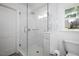 Bathroom with a glass-enclosed shower and white subway tile at 806 Edmund St, Raleigh, NC 27604