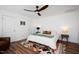 Bright bedroom with a ceiling fan, hardwood floors, and a colorful rug at 806 Edmund St, Raleigh, NC 27604