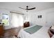 Spacious bedroom with neutral tones, a ceiling fan, and large windows at 806 Edmund St, Raleigh, NC 27604