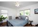 Bedroom featuring hardwood floors, a ceiling fan, and ample natural light at 806 Edmund St, Raleigh, NC 27604