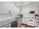 Modern kitchen with white cabinets, granite countertops, stainless steel appliances, and ample storage at 806 Edmund St, Raleigh, NC 27604
