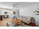 Bright living room boasts a ceiling fan, hardwood floors, fireplace, and ample natural light at 806 Edmund St, Raleigh, NC 27604