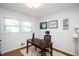 Bright home office space with a dark wooden desk, neutral walls, and an inviting work atmosphere at 806 Edmund St, Raleigh, NC 27604