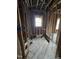 Unfinished bathroom space with exposed studs and new window installation at 827 Sunset Ave, Rocky Mount, NC 27804