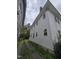 A narrow driveway runs alongside the house, and the siding of the house is white at 827 Sunset Ave, Rocky Mount, NC 27804