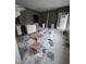 Living room under renovation featuring fresh paint, cabinet installs, and doorway access at 827 Sunset Ave, Rocky Mount, NC 27804