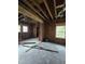 Unfinished room with exposed studs, visible ductwork and new window installations at 827 Sunset Ave, Rocky Mount, NC 27804