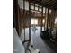 Unfinished room showcasing exposed studs, brick and new window installations at 827 Sunset Ave, Rocky Mount, NC 27804