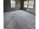 Empty room with freshly painted walls, hardwood floors, and bright natural lighting at 827 Sunset Ave, Rocky Mount, NC 27804
