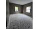 Empty bedroom with freshly painted walls, hardwood floors, and bright natural lighting at 827 Sunset Ave, Rocky Mount, NC 27804