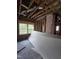 Unfinished room with exposed brick and new windows at 827 Sunset Ave, Rocky Mount, NC 27804