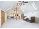 Large bonus room features neutral carpet, skylights and a cozy place to relax at 8407 Millers Bnd, Bahama, NC 27503