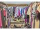 Walk-in closet with clothing, shoe storage, and open shelving, providing ample storage space at 8407 Millers Bnd, Bahama, NC 27503