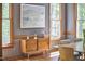 Dining area with bright natural light, modern artwork and furniture creating a calming atmosphere at 8407 Millers Bnd, Bahama, NC 27503